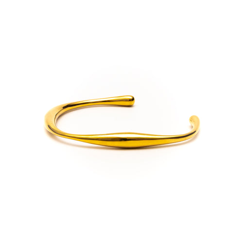 Gold bangle on a white background