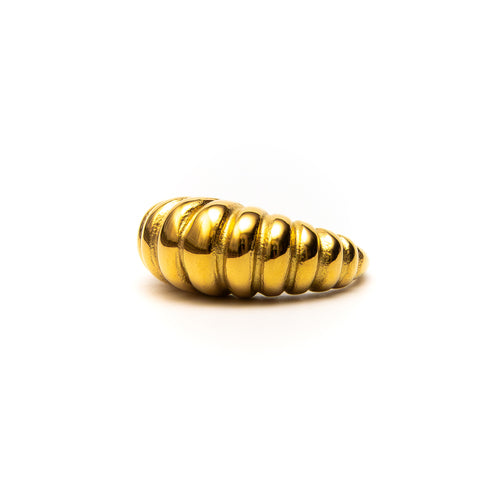 Gold ring with a ribbed design on a white background